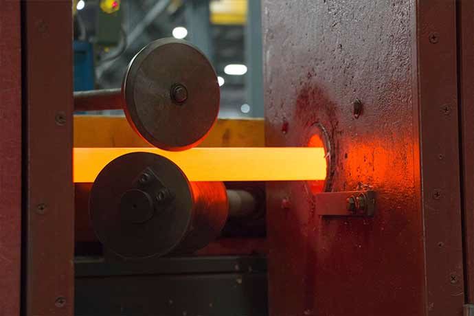 Steel bar going through quench and temper process