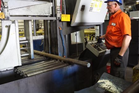 Worker Operating a Bandsaw