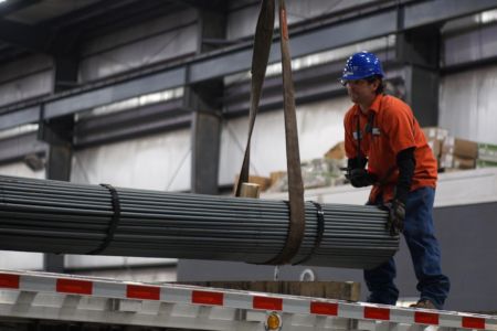 Worker Moving Steel